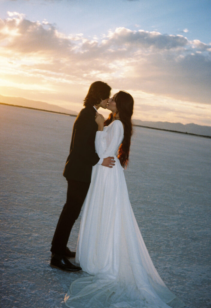 Film photography of bride and groom during elopement at golden hour at Bonneville Salt Flats in Utah.